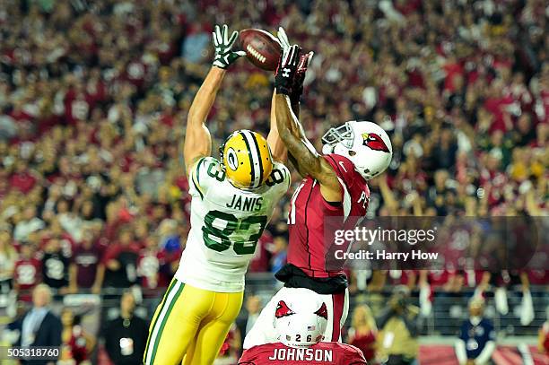 Wide receiver Jeff Janis of the Green Bay Packers catches a 41-yard touchdown on the final play of regulation against cornerback Patrick Peterson of...