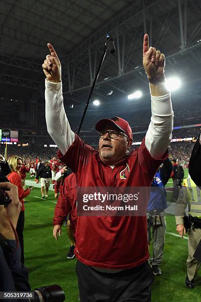 Head coach Bruce Arians of the Arizona Cardinals celebrates while walking off the field after beating the Green Bay Packers 26-20 in overtime of the...