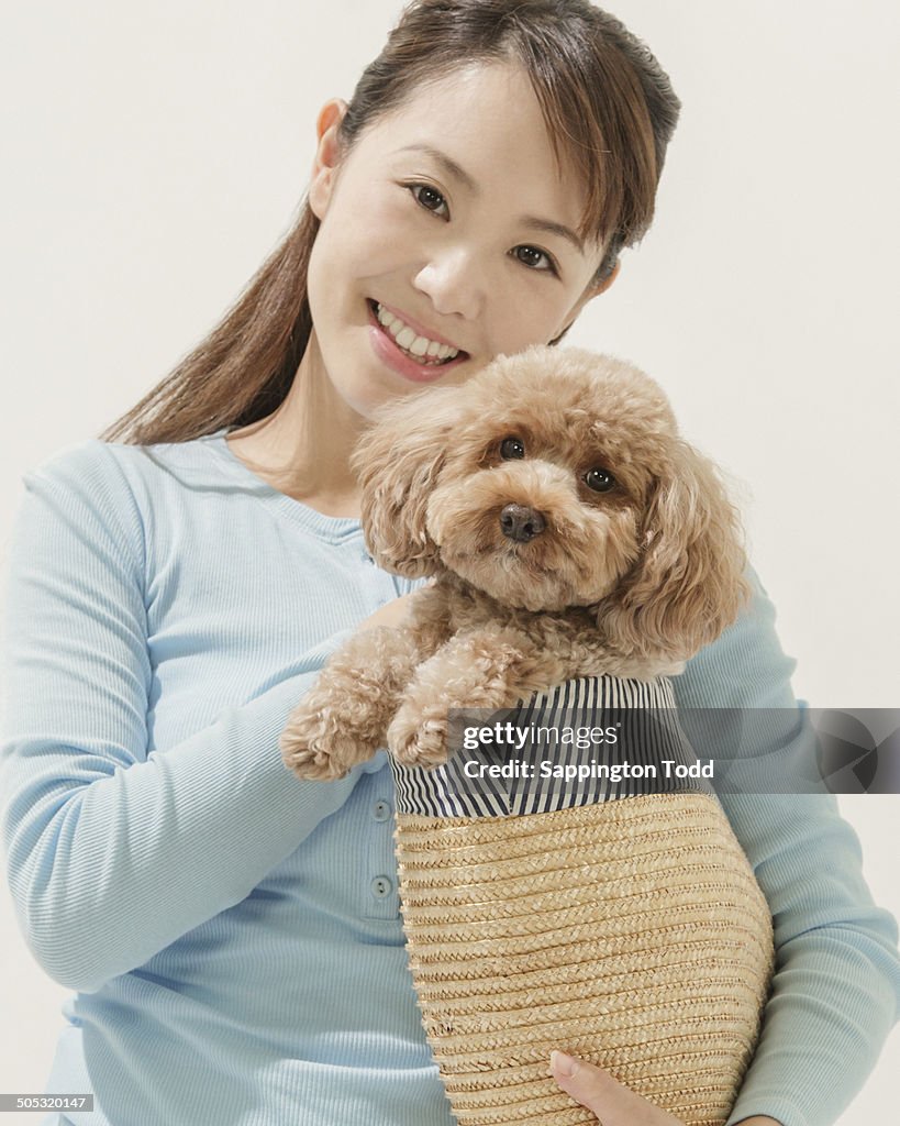 Young Woman With Toy Poodle