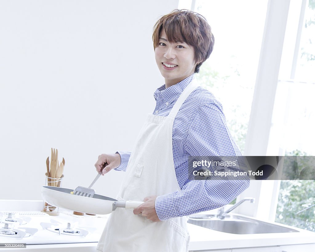 Young Man Preparing Food