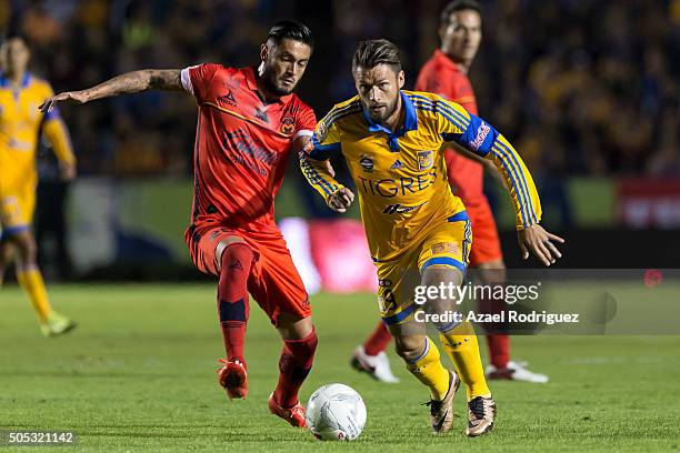 Rafael Sobis of Tigres fights for the ball with Rodrigo Millar of Morelia during the 2nd round match between Tigres UANL and Morelia as part of the...