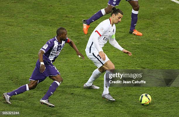 Jean-Daniel Akpa-Akpro of Toulouse and Zlatan Ibrahimovic of PSG in action during the French League 1 match between Toulouse FC and Paris...
