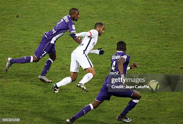 Lucas Moura of PSG in action between Jean-Daniel Akpa-Akpro and Tongo Doumbia of Toulouse during the French League 1 match between Toulouse FC and...