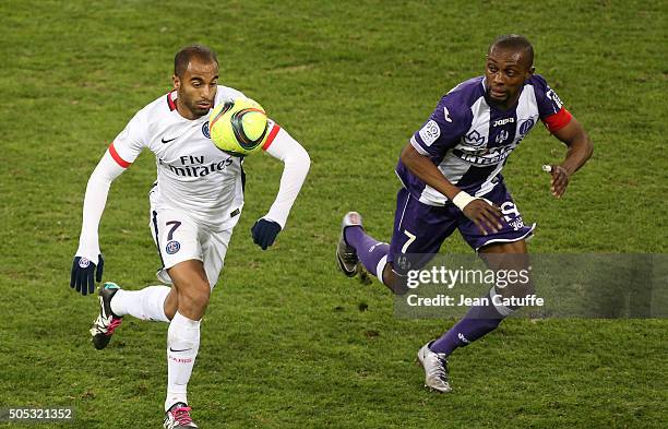 Lucas Moura of PSG and Jean-Daniel Akpa-Akpro of Toulouse in action during the French League 1 match between Toulouse FC and Paris Saint-Germain at...