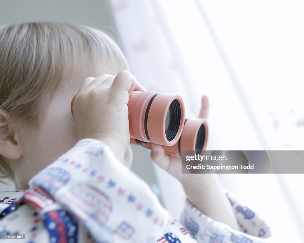 Boy Looking Through Binocular