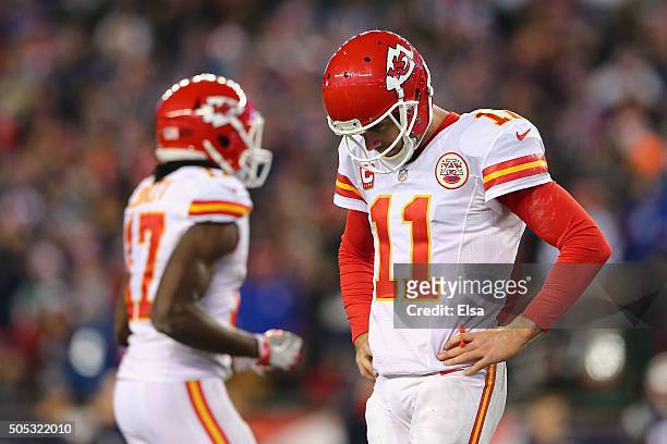 Alex Smith of the Kansas City Chiefs reacts in the second half against the New England Patriots during the AFC Divisional Playoff Game at Gillette...