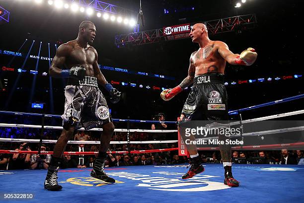 Artur Szpilka reacts against Deontay Wilder during their WBC Heavyweight Championship bout at Barclays Center on January 16, 2016 in Brooklyn borough...