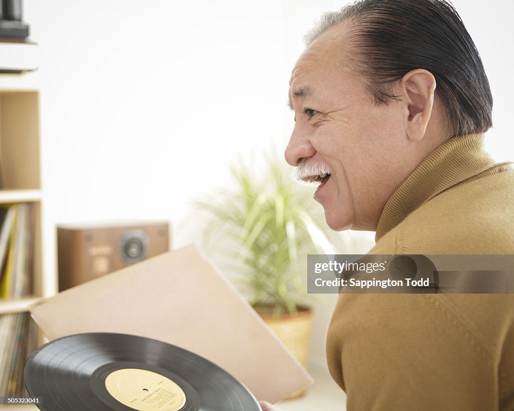 Senior Man With Vinyl Record