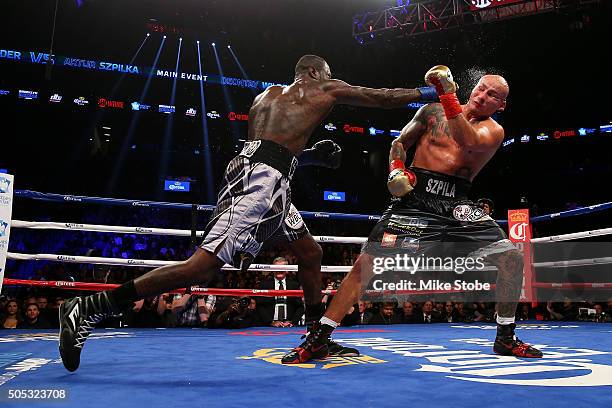 Deontay Wilder punches Artur Szpilka during their WBC Heavyweight Championship bout at Barclays Center on January 16, 2016 in Brooklyn borough of New...