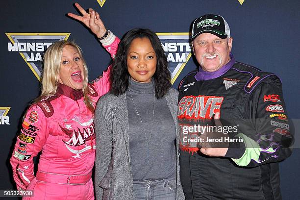 Madusa, Garcelle Beauvais and Dennis Anderson arrive at the Monster Jam at Angel Stadium of Anaheim on January 16, 2016 in Anaheim, California.