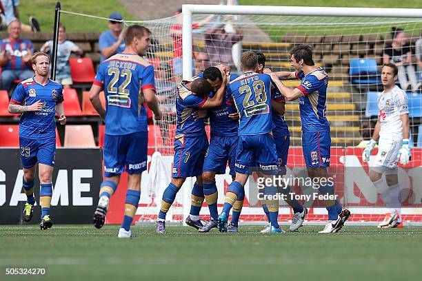 Milos Trifunovic of the Jets celebrates a goal with team mates during the round 15 A-League match between the Newcastle Jets and the Wellington...