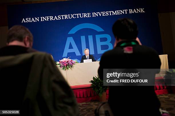 Jin Liqun , the first president of the Asian Infrastructure Investment Bank , speaks to journalists during a press conference in Beijing on January...