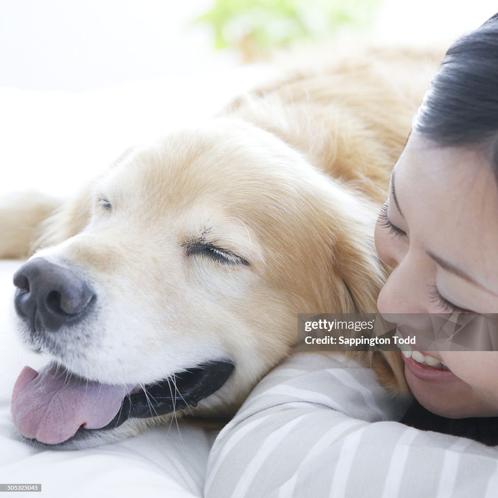 Young Woman With Golden Retriever