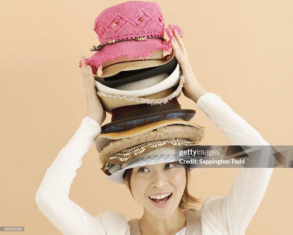 Young Woman Carrying Hat