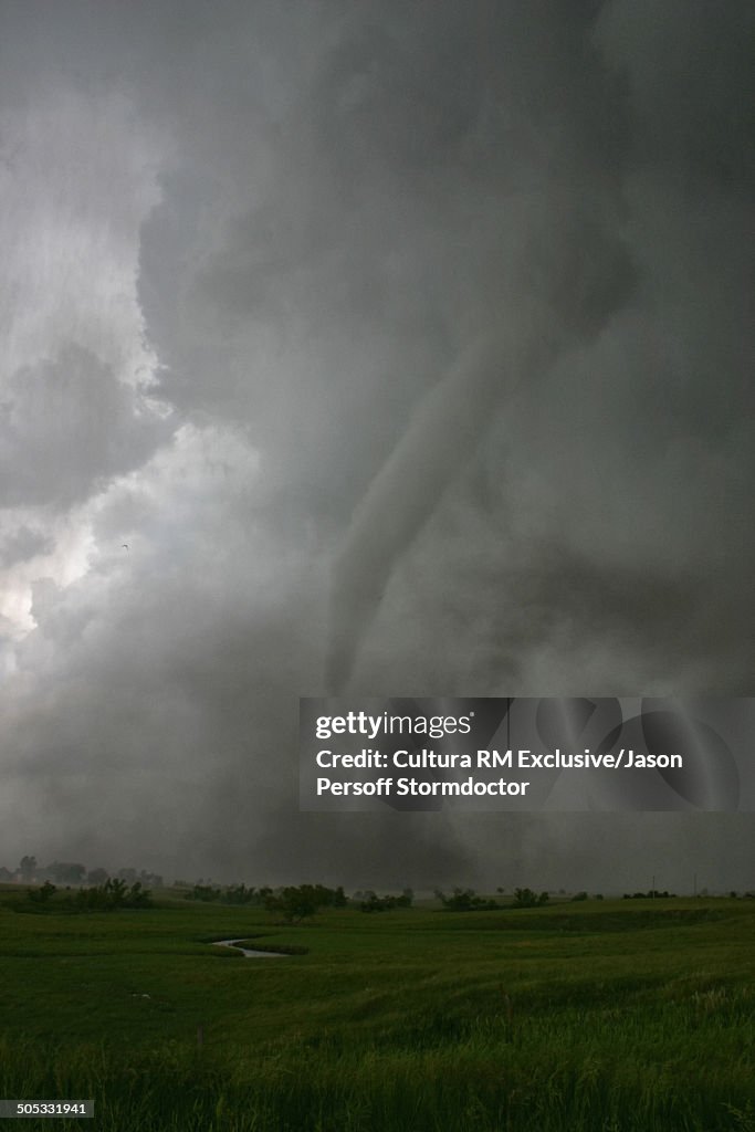 A rain-wrapped tornado touches down less than half a mile away in springtime, Hebron, Nebraska, USA