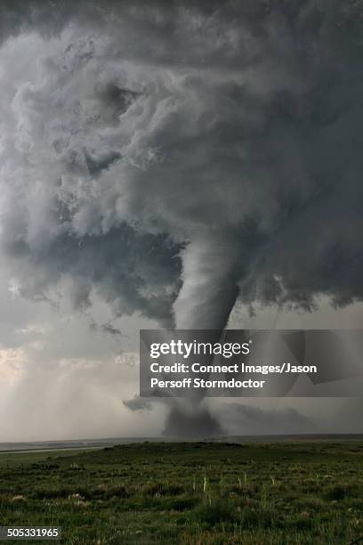 intense rotation through the """"barber poling"""" of bands spiraling up the tornado. at the base there is evidence of horizontal swirls and multiple vortices in the main circulation, campo, colorado, usa - tornado stock pictures, royalty-free photos & images