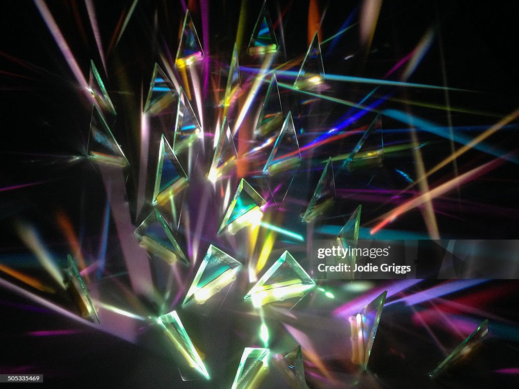 Multiple prisms of light shining in various angles