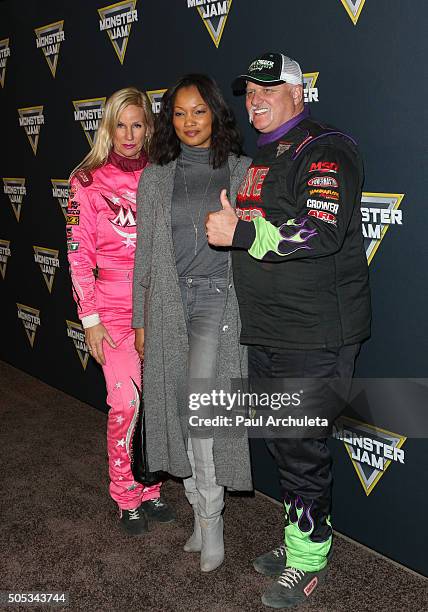 Madusa, Garcelle Beauvais and Dennis Anderson attend Monster Jam at Angel Stadium of Anaheim on January 16, 2016 in Anaheim, California.