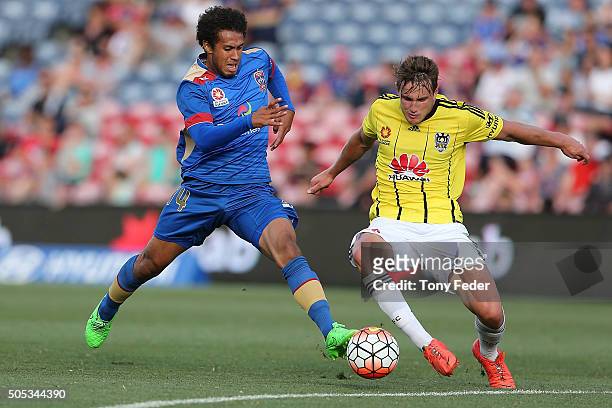 Mitch Cooper of the Jets contests the ball with Dylan Fox of the Phoenix during the round 15 A-League match between the Newcastle Jets and the...
