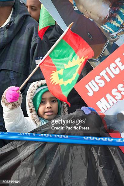 Child among the demonstrators waives an Oromian flag. Several hundred Ethiopian-American demonstrators from around the U.S. Gathered opposite United...