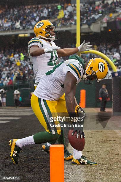 Wide receiver James Jones of the Green Bay Packers celebrates a 30-yard touchdown against the Oakland Raiders in the third quarter on December 20,...