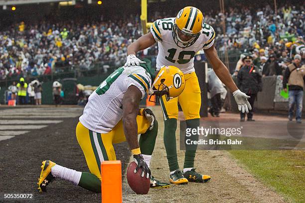 Wide receiver James Jones of the Green Bay Packers celebrates a 30-yard touchdown with Randall Cobb against the Oakland Raiders in the third quarter...