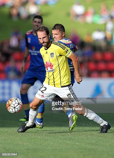 Andrew Durante of the Phoenix runs the ball ahead of the Jets defence during the round 15 A-League match between the Newcastle Jets and the...