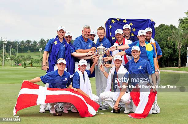 Team Europe celebrates with the Eurasia Cup after they beat Asia during the final day's singles matches at Glenmarie G&CC on January 17, 2016 in...