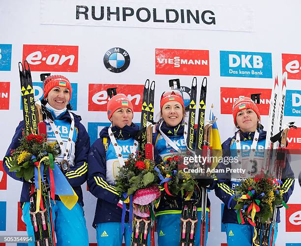 Iryna Varvynets, Yulia Dzhima, Valj Semerenko and Olena Pidhrushna of the Ukraine celebrate first place on the podium after the Women's 4x 6km relay...