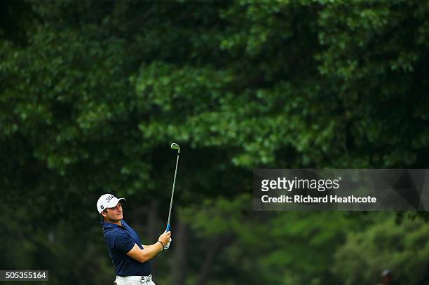 Zander Lombard of South Africa plays his second shot on the 8th hole on the East Course during day four and the final round of the Joburg Open at...