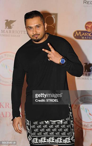 Indian Bollywood singer Honey Singh poses for a photograph during the Vikram Phadnis fashion show in Mumbai on late January 16, 2016. AFP PHOTO / STR...