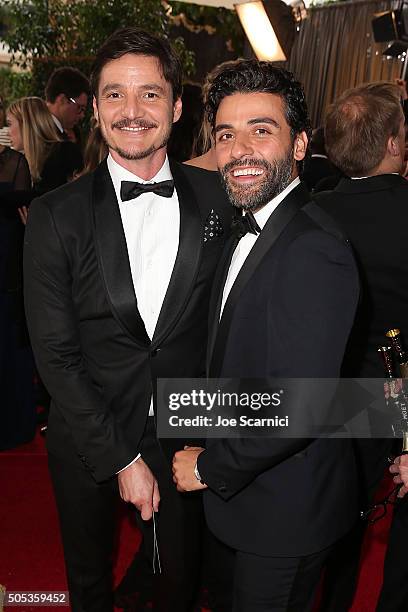 Pedro Pascal and Oscar Isaac attend the 73rd Annual Golden Globe Awards held at The Beverly Hilton Hotel on January 10, 2016 in Beverly Hills,...