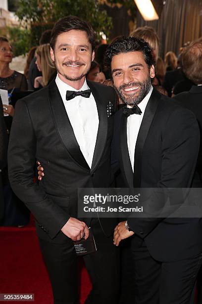 Pedro Pascal and Oscar Isaac attend the 73rd Annual Golden Globe Awards held at The Beverly Hilton Hotel on January 10, 2016 in Beverly Hills,...