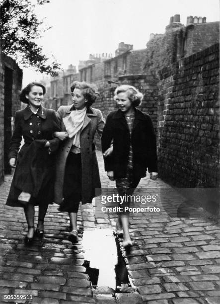 Fifteen year old Marie O'Connor meets with friends Rosemarie Cahill and Maureen McShane after working her shift at the Liverpool Tobacco factory,...