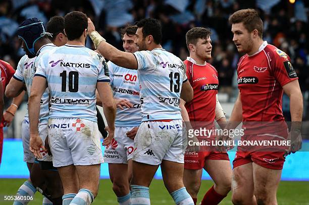 Racing Metro 92 New Zealand centre Casey Laulala is congratulated by teammates after scoring a try during the European Rugby Champions Cup match...