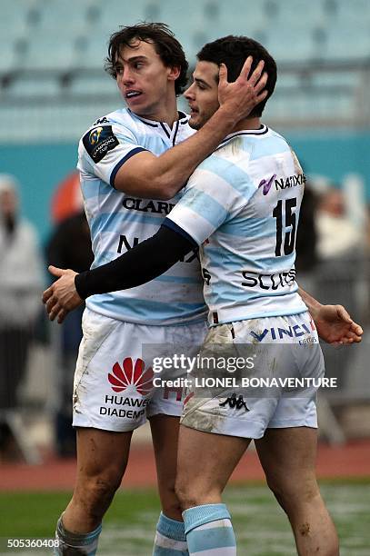 Racing Metro 92 Argentine wing Juan Imhoff is congratulated by Racing Metro 92 French fullback Brice Dulin after scoring a try during the European...