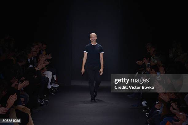 Designer Italo Zucchelli acknowledges the applause of the public after the Calvin Klein Collection show during Milan Men's Fashion Week Fall/Winter...