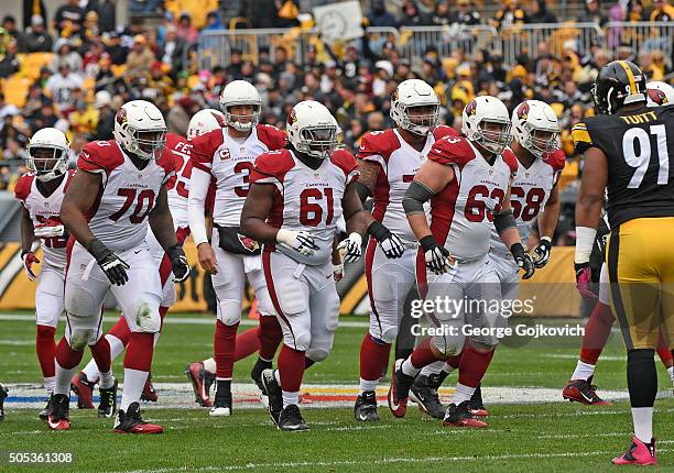 Members of the offensive line of the Arizona Cardinals, including tackle Bobby Massie, guard Jonathan Cooper, center Lyle Sendlein, guard Mike Iupati...