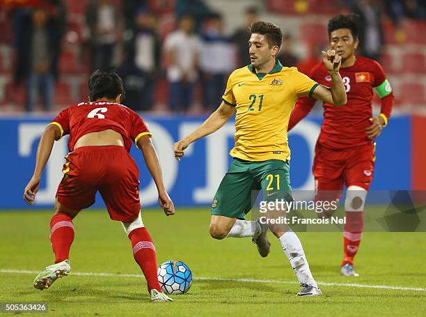 Brandon Borrello of Australia takes on Bui Tien Dung of Vietnam during the AFC U-23 Championship Group D match between Vietnam and Australia at Grand...