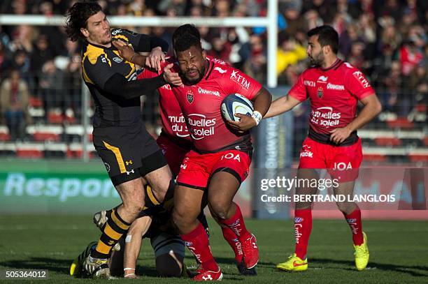 Toulon's English flanker Steffon Elvis Armitage vies with Wasps' Autralian centre Ben Jacobs during the European Champions Cup rugby union match RC...