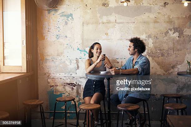 their first date was so good they kept coming back - couple in cafe coffee stock pictures, royalty-free photos & images
