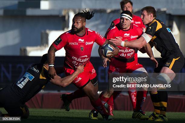 Toulon's French centre Mathieu Bastareaud vies with Wasps' flanker from Australia George Smith during the European Champions Cup rugby union match RC...