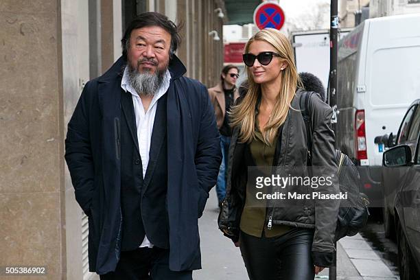 Paris Hilton is seen with artist Ai Wei Wei as they visit the 'Ai Wei Wei Er Xi' exhibition at Le Bon Marche department store on January 17, 2016 in...