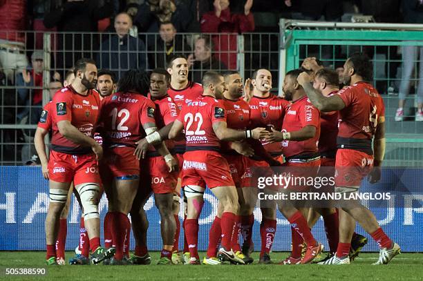 RCToulon's players celebrate after scoring a try during the European Champions Cup rugby union match RC Toulon vs Wasps on January 17, 2016 at the...