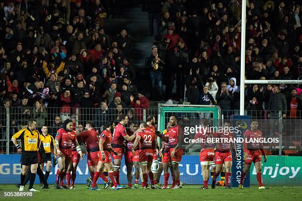 RCToulon's players celebrate after scoring a try during the European Champions Cup rugby union match RC Toulon vs Wasps on January 17, 2016 at the...