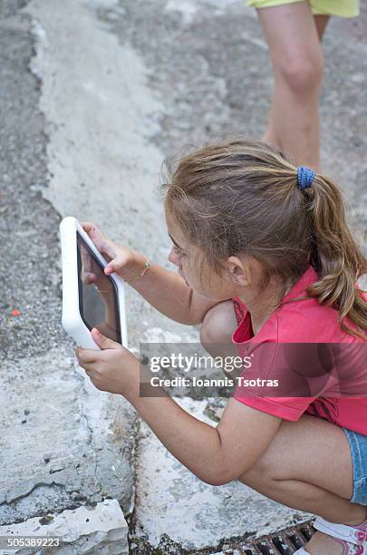 kid playing with tablet - kataraktis village stock pictures, royalty-free photos & images