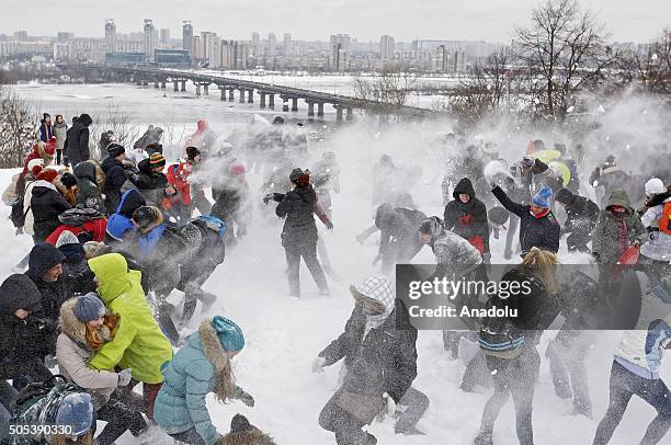 Ukrainians throw snowballs at each other during mass event called "The Snow battle-2016" at the park of the Great Patriotic War, in Kiev, Ukraine on...