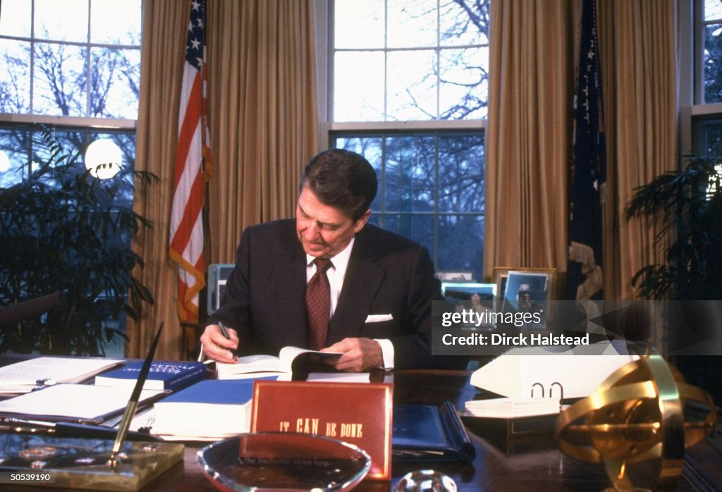 Donald Reegan President Ronald Reagan working on economic report and legislative ...