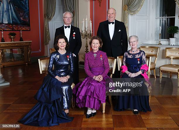 Picture taken on January 17, 2016 at the Royal Castle in Oslo shows King Carl Gustaf of Sweden and King Harald of Norway and, Queen Silvia of Sweden,...