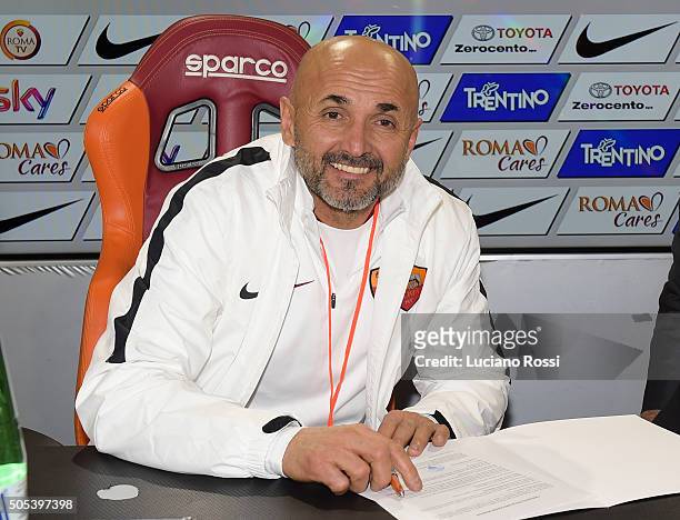 New coach of AS Roma Luciano Spalletti signs the contract after his first training session on January 14, 2016 in Rome, Italy.